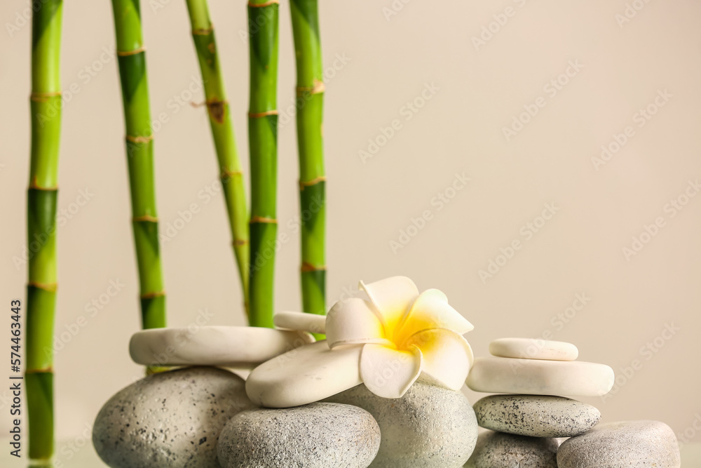 Spa stones, flower and bamboo on light background Spa stones, flower and bamboo on light background