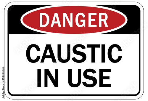 Caustic danger chemical hazard sign and labels caustic in use