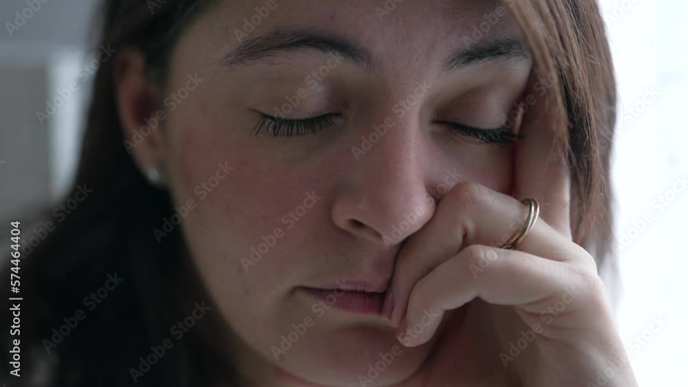 Worried woman with thoughtful expression. Depressed person thinking about mental problems Worried woman with thoughtful expression. Depressed person thinking about mental problems