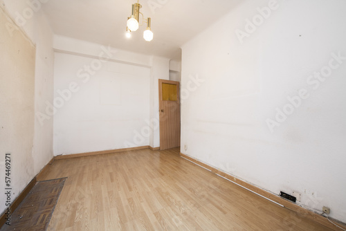 Wallpaper Mural Empty room of a house with wooden floors and a lamp with three glass shades Torontodigital.ca