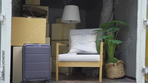 Truck car moving house for customers, delivering boxes and furniture. Vehicle transportation. Shipping and packaging business occupation service company. People lifestyle.
