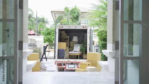 Truck car moving house for customers, delivering boxes and furniture. Vehicle transportation. Shipping and packaging business occupation service company. People lifestyle.
