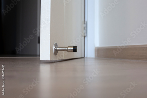 Obraz na plátně White door with door stopper