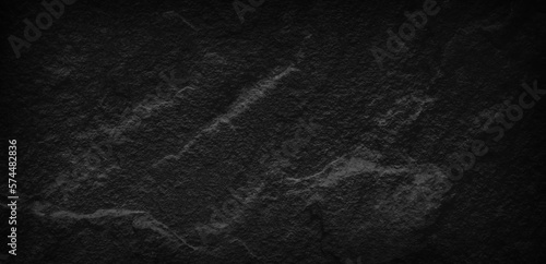 Dark gray black slate stone background or texture, horizontal shape with space for design. Web banner. Wide. Panoramic. Website header