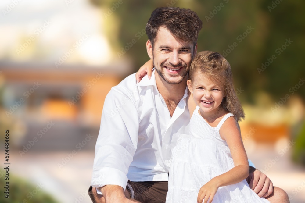 Fototapeta premium Happy young father play with cute child in park
