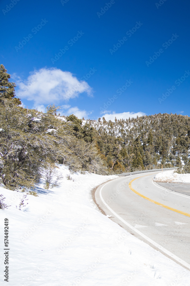 Road and snow covered mountains at Spring Mountain National Recreation Area, Nevada Road and snow covered mountains at Spring Mountain National Recreation Area, Nevada
