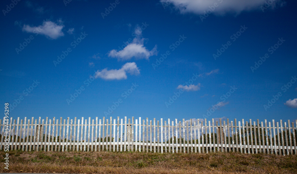 A Rustic old wooden fence protecting peaceful New England meadow A Rustic old wooden fence protecting peaceful New England meadow