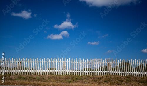 A Rustic old wooden fence protecting peaceful New England meadow