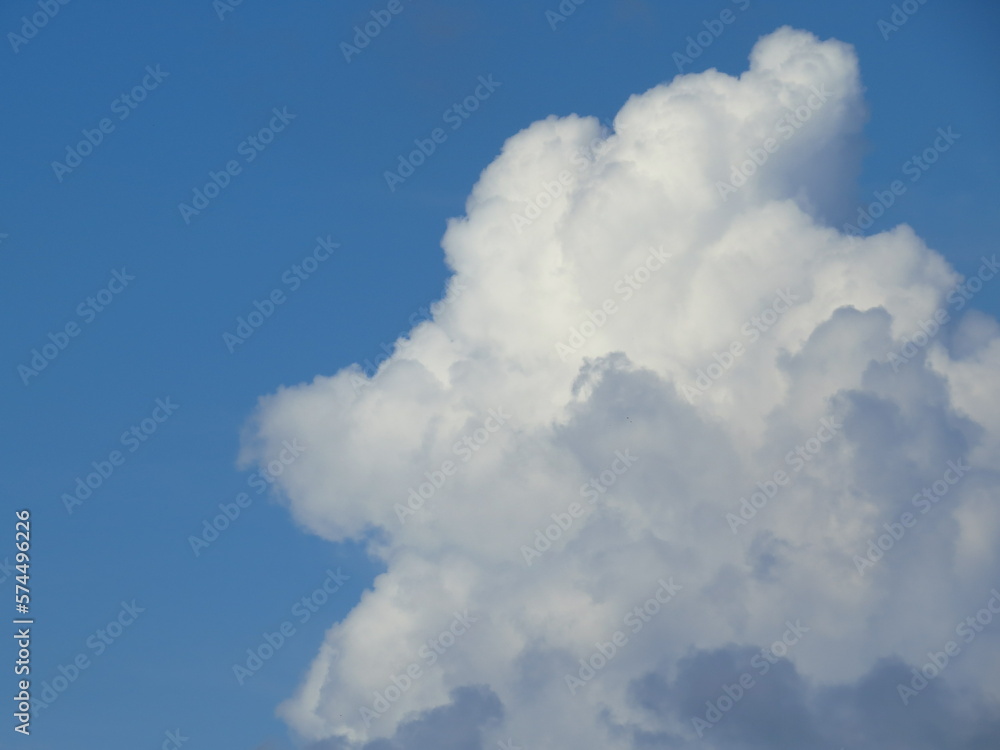 a fluffy clouds in blue sky. Background from clouds. a fluffy clouds in blue sky. Background from clouds.