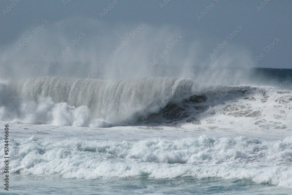 High waves and stormy ocean. Big waves with a foamy crest. Photo of Fuerteventura in the Canary Islands, Spain. High waves and stormy ocean. Big waves with a foamy crest. Photo of Fuerteventura in the Canary Islands, Spain.