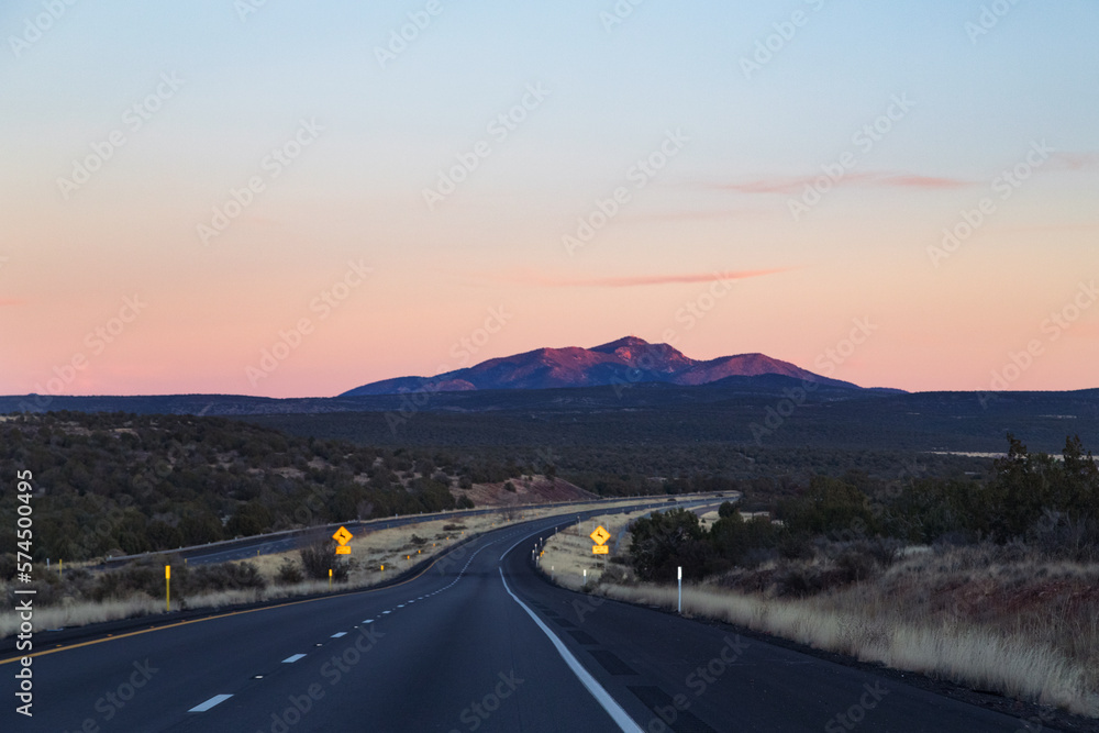 Fototapeta premium road to the mountains in sunset