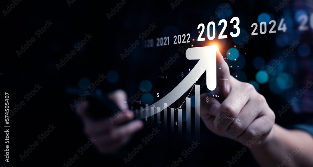 Business growing in 2023. Analytical businessman planning business growth 2023, strategy digital marketing, profit income, economy, stock market trends and business