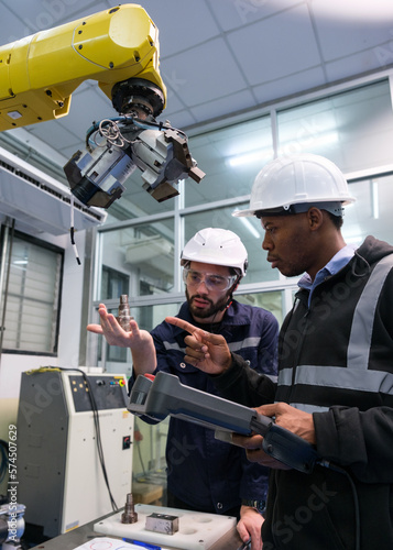 Engineer working in robotics factory