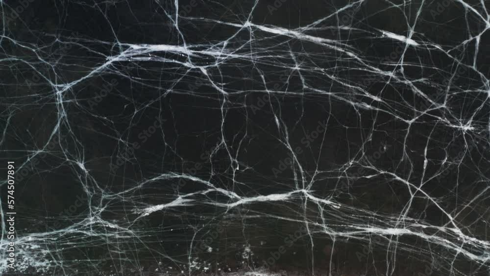 Abstract lines in cracked ice surface of lake, top down Abstract lines in cracked ice surface of lake, top down