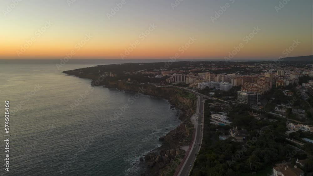 Beautiful evening sunset in the Atlantic Ocean at Marinha, Cascais, Portugal coast. Aerial view. waves in motion. Beautiful evening sunset in the Atlantic Ocean at Marinha, Cascais, Portugal coast. Aerial view. waves in motion.