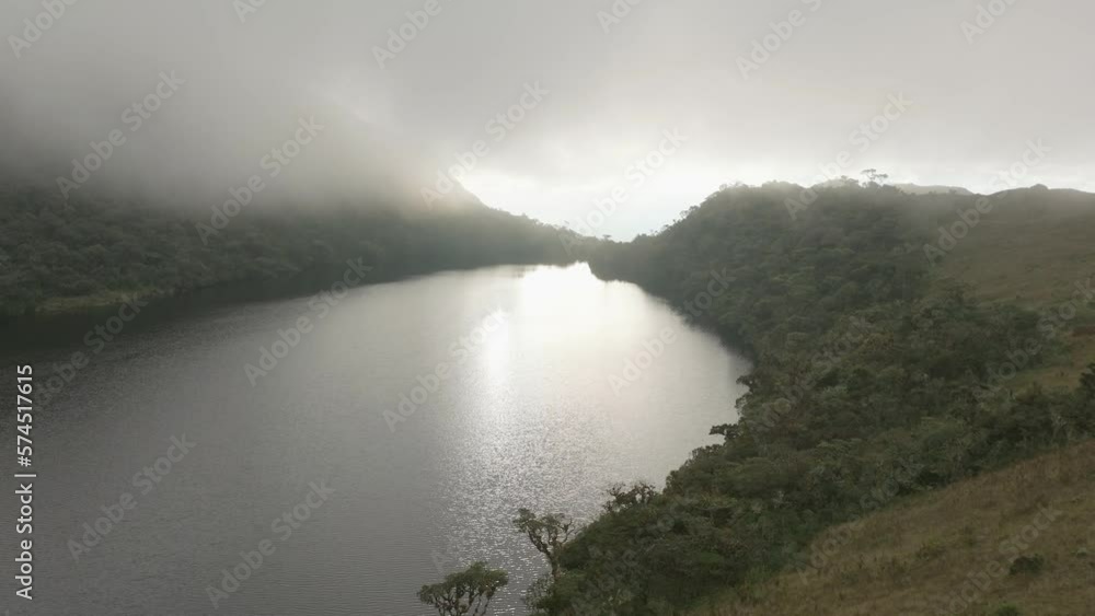 Aerial view of lake and cloud forest in the andes of Peru at sunset. Aerial view of lake and cloud forest in the andes of Peru at sunset.