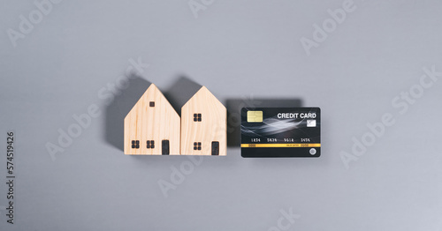 Top view table with credit card and house model.