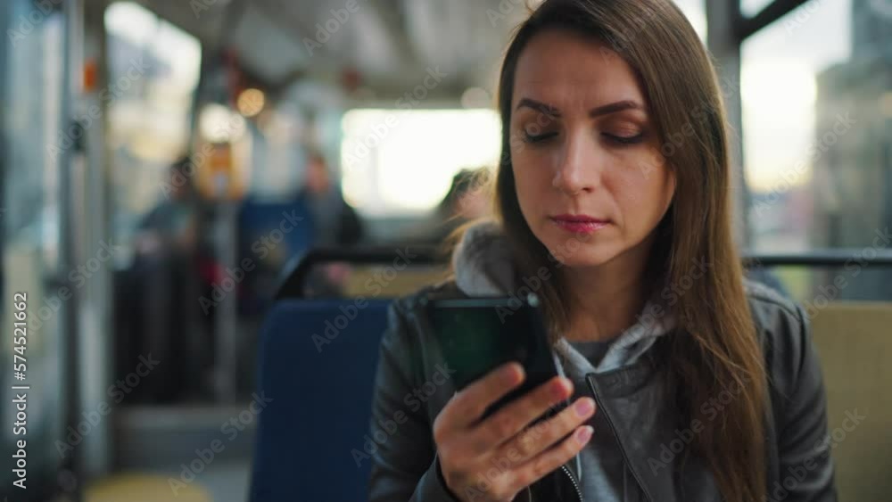 Public transport. Woman using smartphone. Public transport. Woman using smartphone.