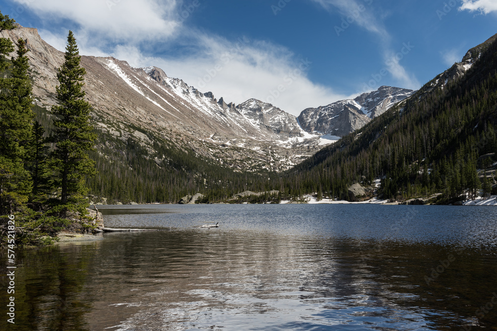 14,259 foot Longs Peak, is the highest mountain in Rocky Mountain National Park. Mills Lake is a travel destination for hikers, that catch the beautiful views of the mountains.