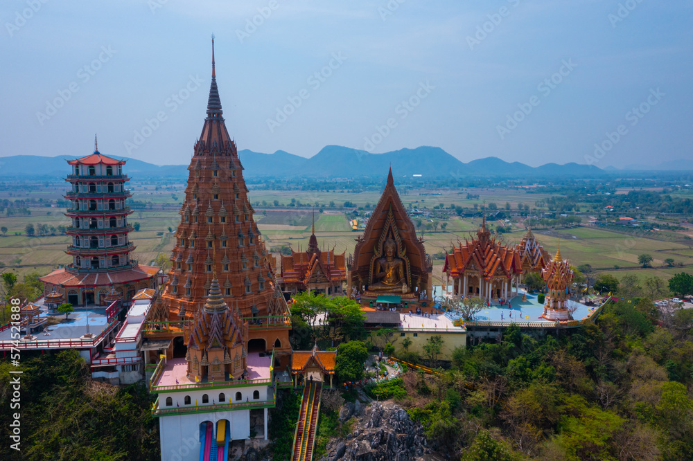 Aerial view of the top of the pagoda, golden buddha mountain (Wat Tham Seua) Thai temples in Kanchanaburi province. 