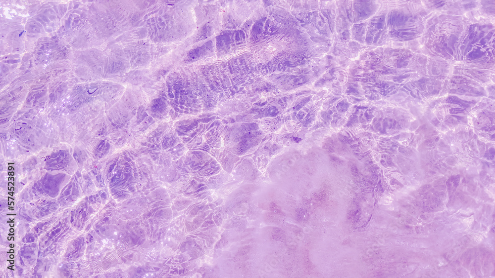 Rippled pattern of clean water in a purple for background