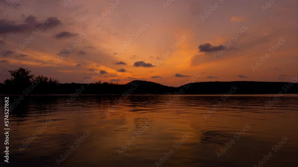 Stunning sunset time lapse over the sea with mountain on the background. Time lapse of sunset at Koh rong sanloem island. Stunning sunset time lapse over the sea with mountain on the background. Time lapse of sunset at Koh rong sanloem island.
