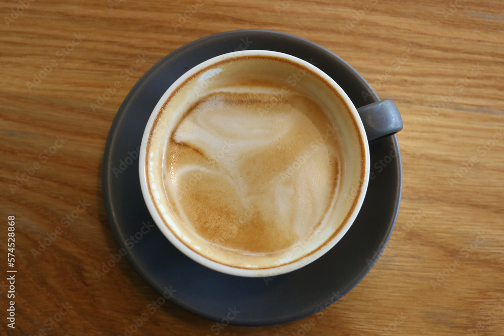 Coffee mugs placed on a table in a coffee shop. Coffee mugs placed on a table in a coffee shop.