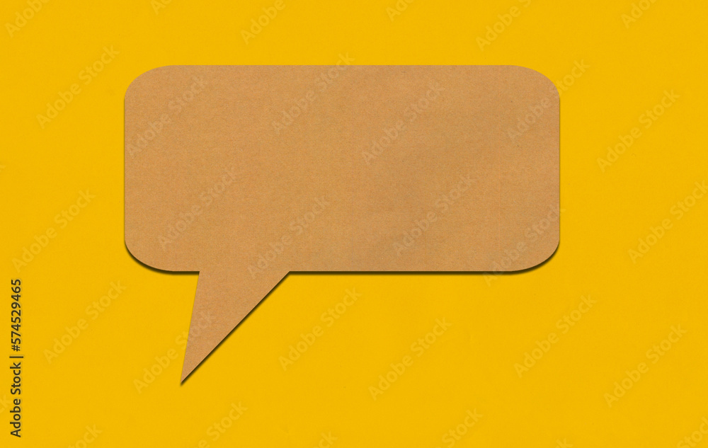 Brown paper speech bubble on yellow paper background. Brown paper speech bubble on yellow paper background.