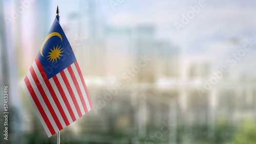 Photography Small flags of the Malaysia on an abstract blurry background