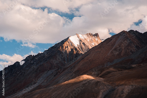 beautiful scene of orange morning light touch the peak of the mountain in Pangong tso, Leh Ladakh, India