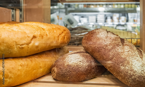 Freshly baked bread on shelfs. Baked products at a supermarket. Healthy and nutritious food