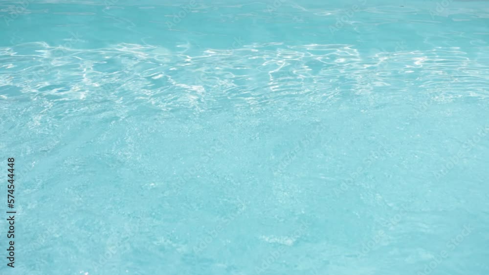 Water ripples in swimming pool. Blue color. Slow motion Water ripples in swimming pool. Blue color. Slow motion