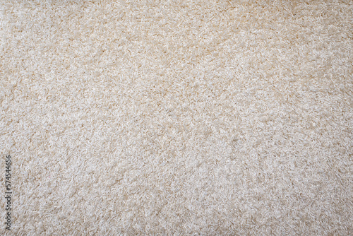 Wide angle shot of off-white carpet background