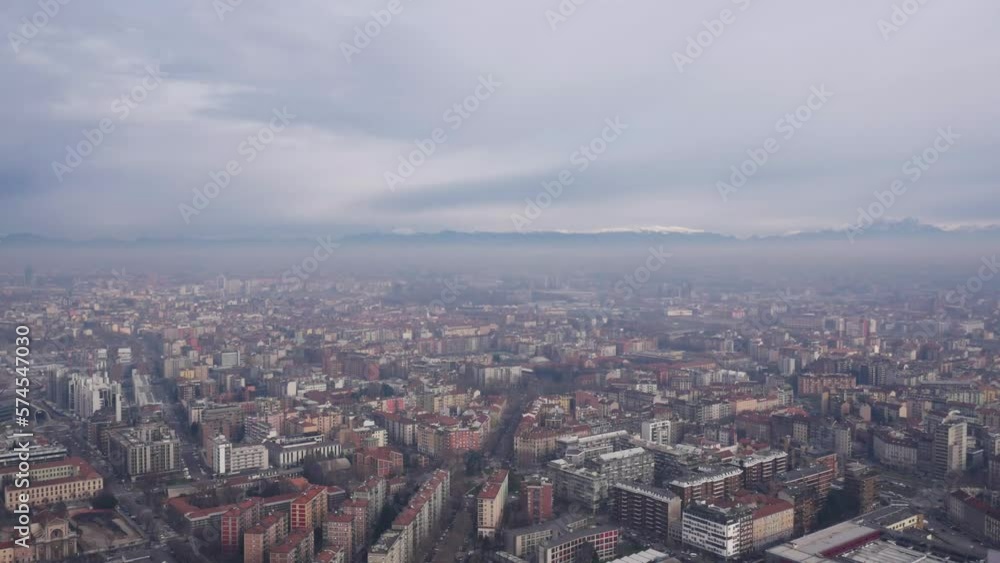 Milan Aerial shot. Foggy sky. Mountains in a distance. Pollution, Weather quality. Milan Aerial shot. Foggy sky. Mountains in a distance. Pollution, Weather quality.