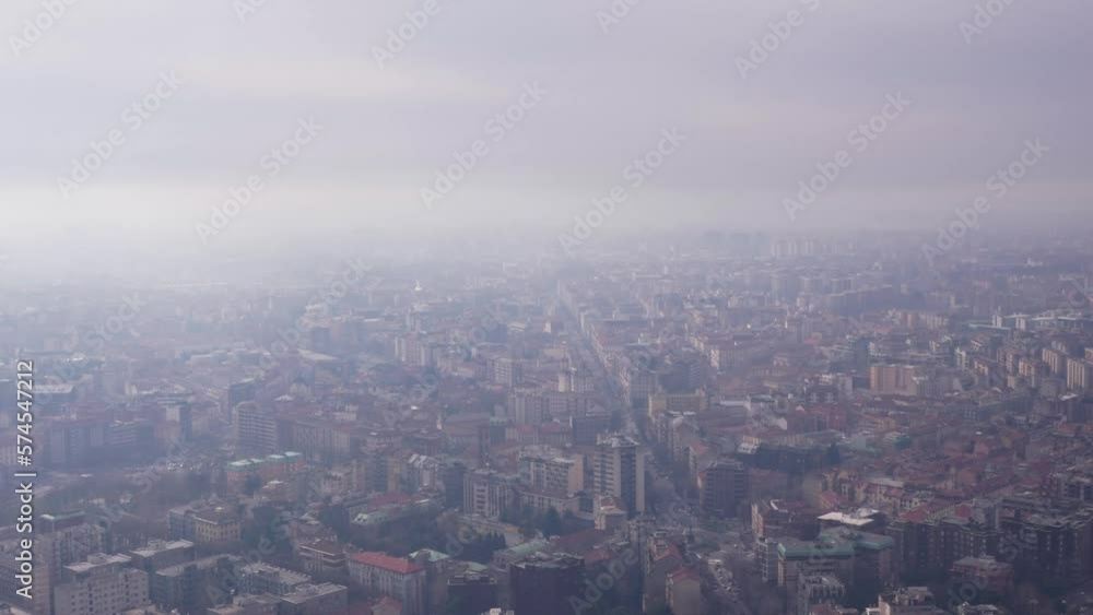 Elevated angle over Milan, Italy. Polluted air in the city. Fog, Haze, Mist. Elevated angle over Milan, Italy. Polluted air in the city. Fog, Haze, Mist.