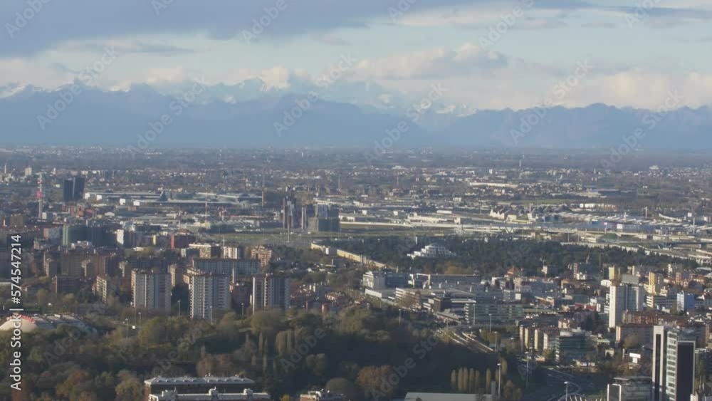 Cinematic skyline of Milan. Dramatic angle of Milan. Mountains and big City. Cinematic skyline of Milan. Dramatic angle of Milan. Mountains and big City.