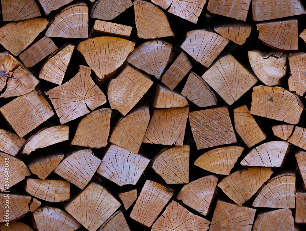 Seamless pattern with firewood on a black background. Repetitive full woodpile. Stock wood for heating. Concept of global fuel crisis and energy impasse Seamless pattern with firewood on a black background. Repetitive full woodpile. Stock wood for heating. Concept of global fuel crisis and energy impasse