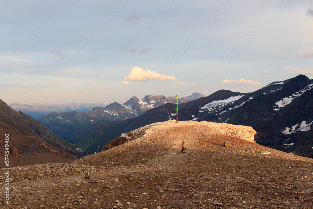 Naklejka premium Mountain panorama view with flag seen from Großer Burgstall in Glockner Group, Austria