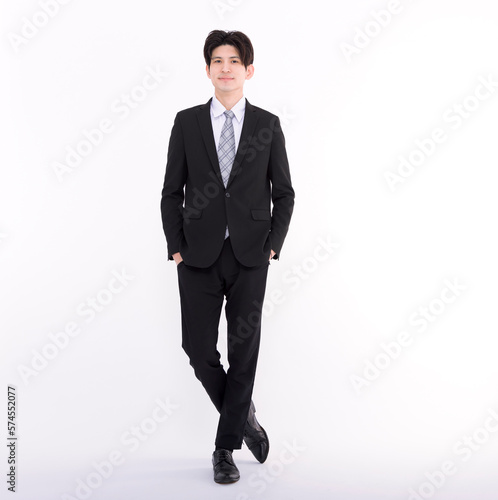 Full length portrait of young businessman standing