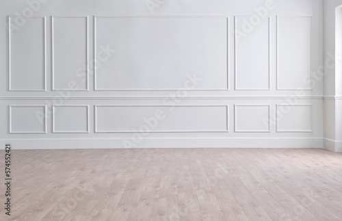 White classic wall background, brown parquet floor, home furniture detail, frame and vase of plant. © UnitedPhotoStudio