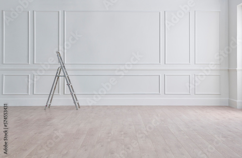 White classic wall, stairs, paint and brush, interior whitewash.