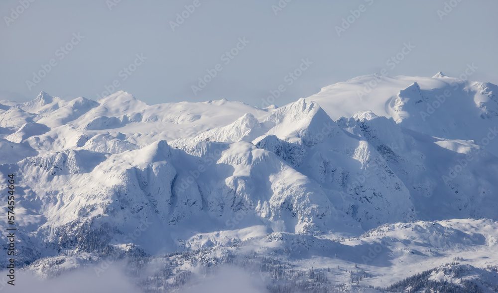 Obraz premium Snow and Cloud covered Canadian Nature Landscape Background. Winter Season in Whistler, British Columbia, Canada. From Blackcomb Mountain
