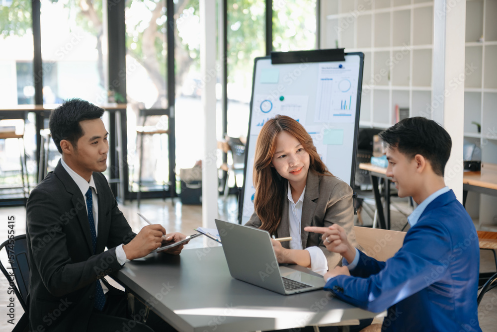Portrait of success business people working together in office. Couple teamwork startup concept Portrait of success business people working together in office. Couple teamwork startup concept