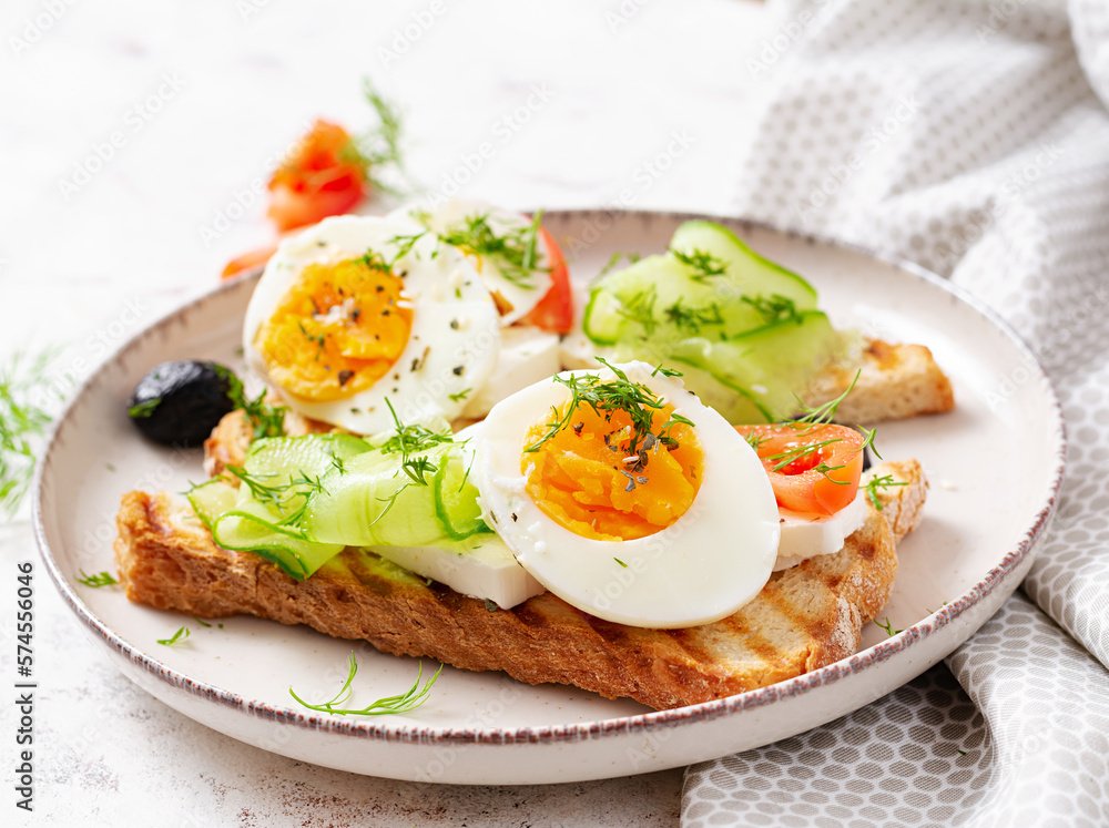 Healthy breakfast. Toast with feta cheese and egg. Healthy balanced food. Healthy breakfast. Toast with feta cheese and egg. Healthy balanced food.