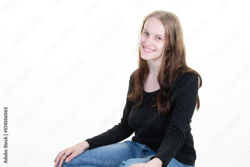 portrait of blond happy young woman smiling girl sitting cross legged isolated on white background portrait of blond happy young woman smiling girl sitting cross legged isolated on white background