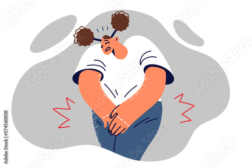 Woman puts hands on groin feeling pain due to urinary tract infection or aggravation of cystitis