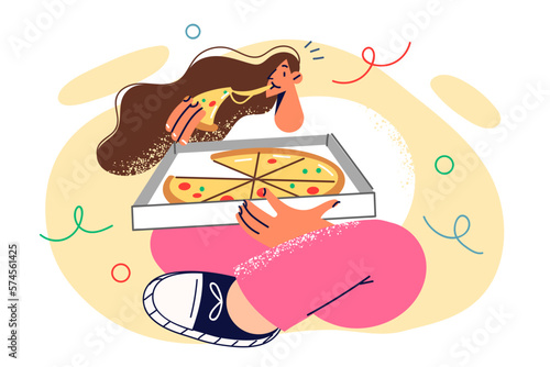 Hungry woman sitting on floor with pizza inside box delivered from italian food restaurant