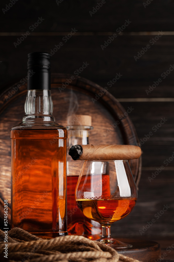 Glass and bottles with cognac Glass and bottles with cognac
