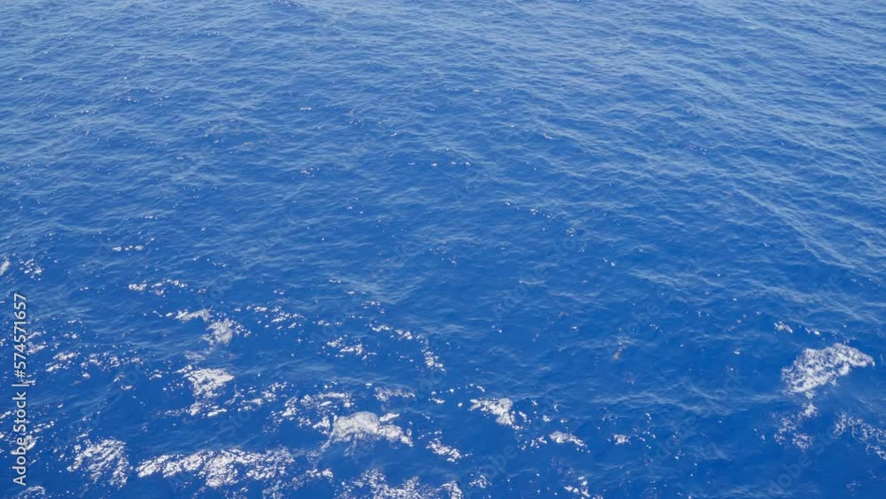 Stunning blue ocean in a moving close up slow motion scene Stunning blue ocean in a moving close up slow motion scene