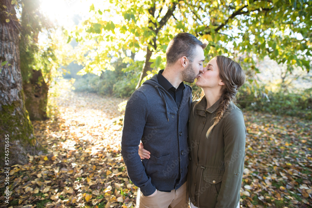 Couple kissing in park Couple kissing in park